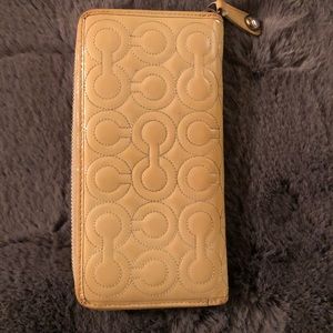 Coach Signature “C” Embossed Wallet.